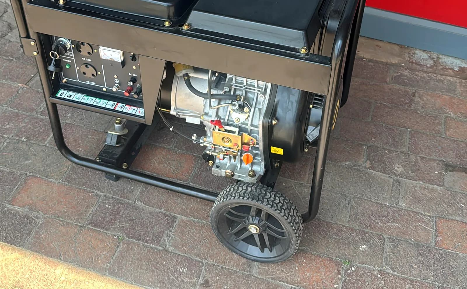 Open-frame portable diesel generator with an air-cooled single-cylinder engine and electric start, on wheels